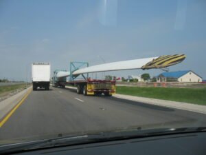 Oversize load heavy-haul truck carrying a wind turbine blade on Interstate 35 in Texas